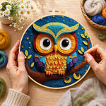 Creating the majestic rainbow owl on a branch wool painting by hand with a felting needle