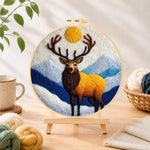 Finished majestic stag in the mountains needle felting displayed on a wooden easel