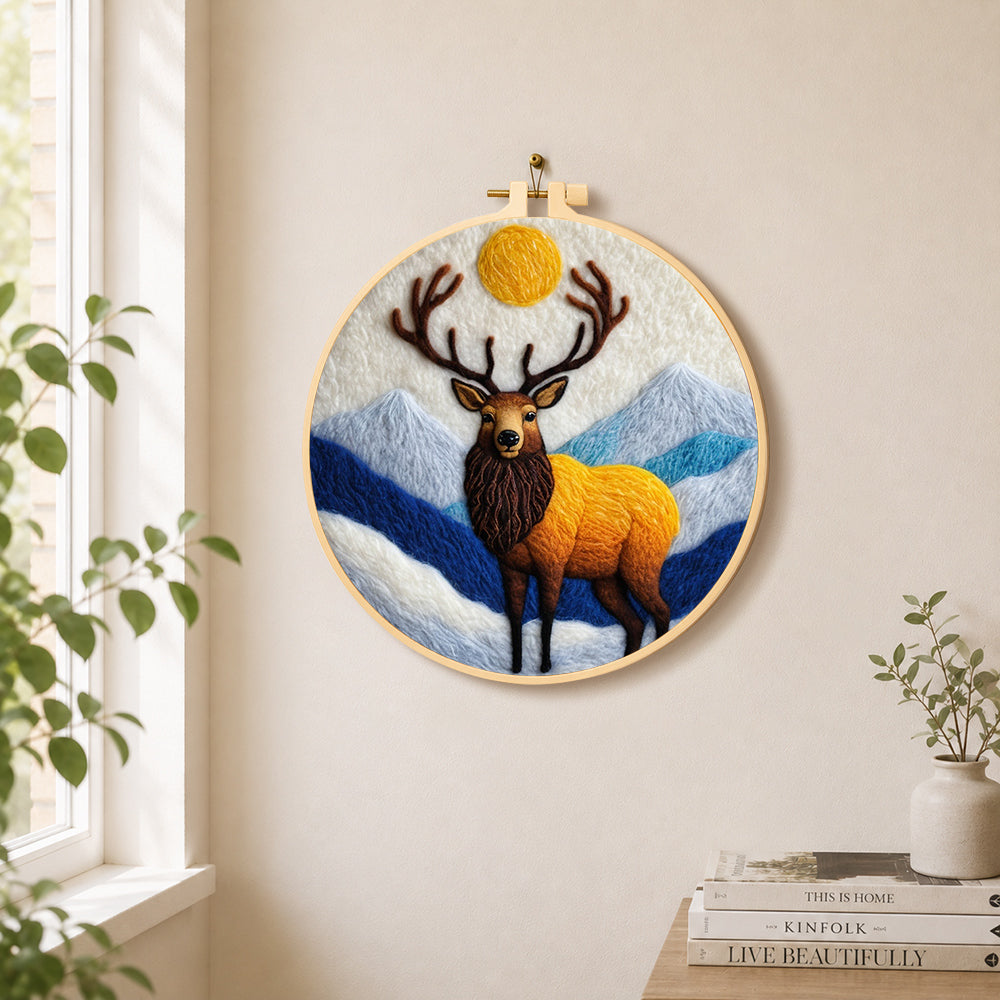 Majestic stag in the mountains needle felt wall art displayed in a bright home interior