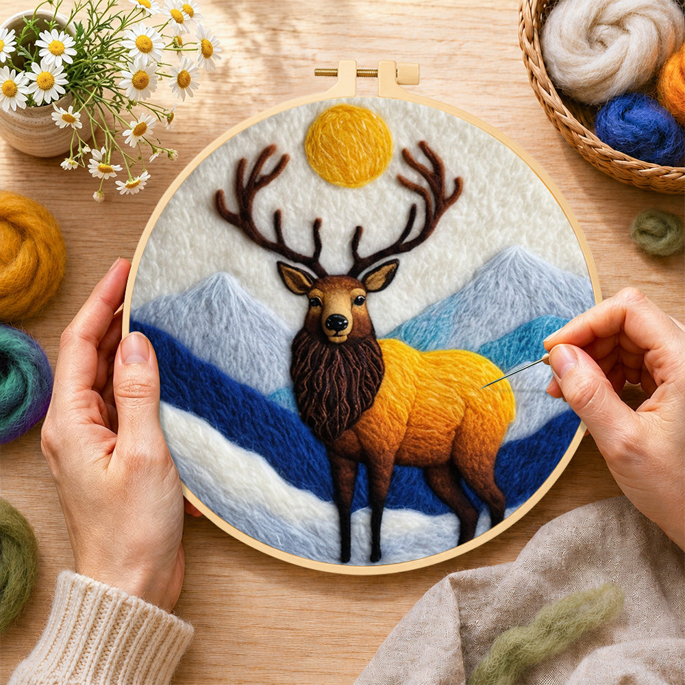 Creating the majestic stag in the mountains wool painting by hand with a felting needle