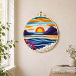 Majestic sunset and blue wavy sea needle felt wall art displayed in a bright home interior