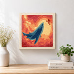 Finished majestic whale sunset artwork displayed on a wall