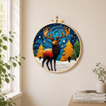 Majestic winter stag needle felt wall art displayed in a bright home interior