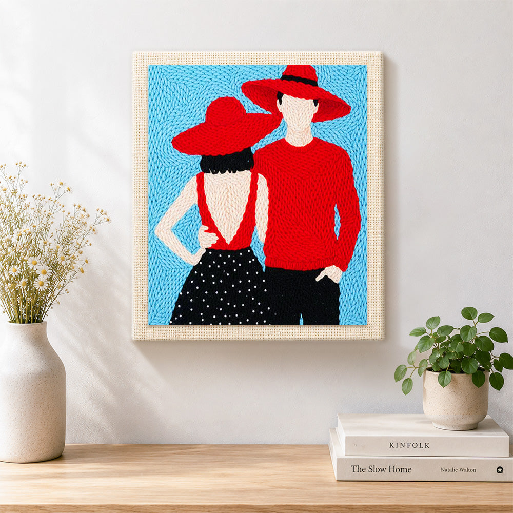 Finished matching red hats couple artwork displayed on a wall