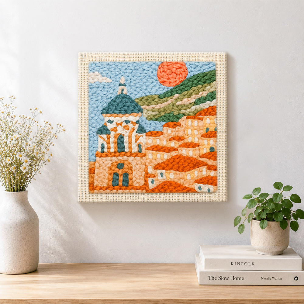 Finished mediterranean coastal town artwork displayed on a wall