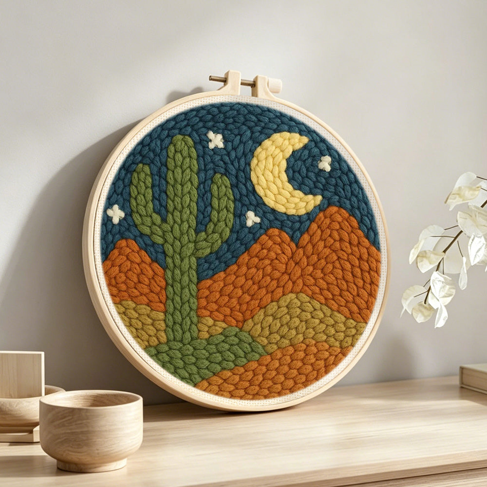 Midnight desert cactus punch needle artwork displayed on a table