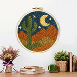 Finished midnight desert cactus artwork displayed on a wall