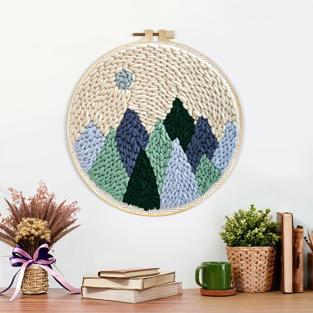 Finished minimal mountain landscape with moon artwork displayed on a wall