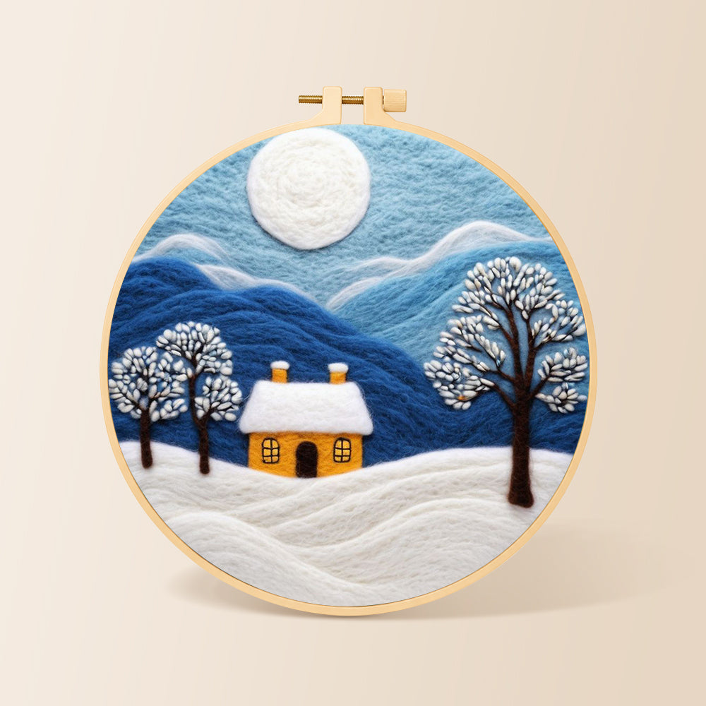 minimalist blue mountains and snowy house needle felting kit for beginners with a round wooden frame