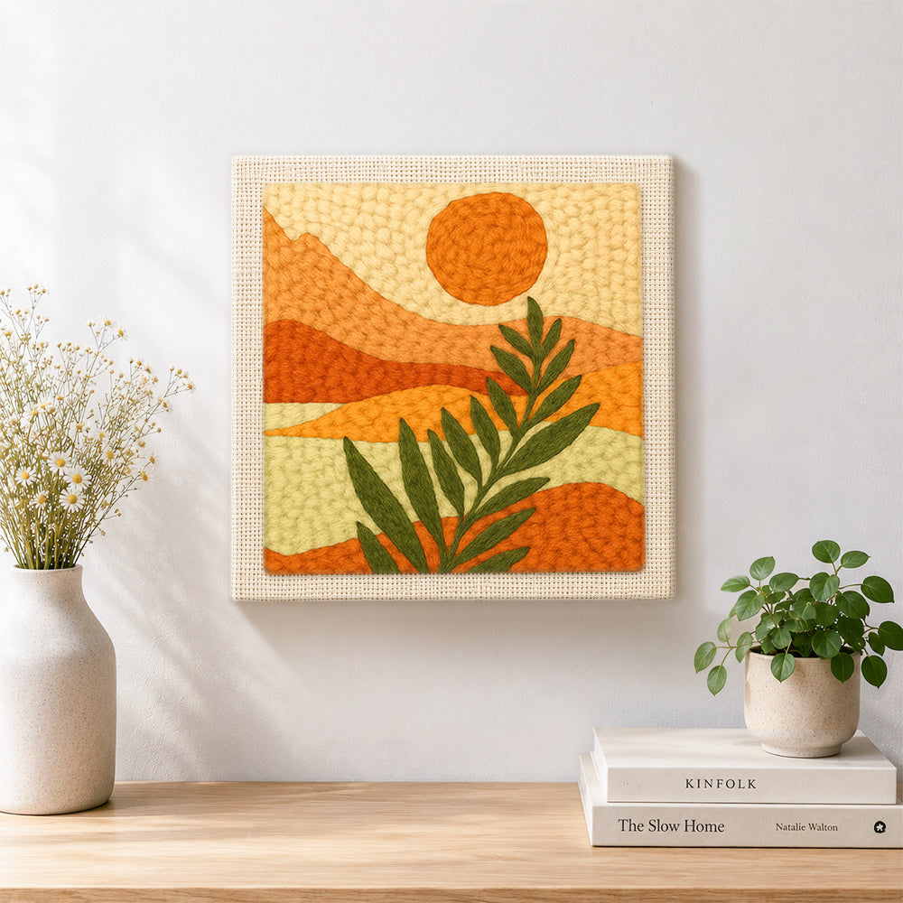 Finished minimalist leaf and mountain scenery artwork displayed on a wall