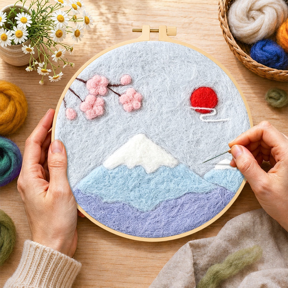 Creating the minimalist mount fuji wool painting by hand with a felting needle