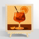 Minimalist orange cocktail with straw and citrus punch needle kit for beginners