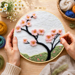 Creating the minimalist pink flower branch wool painting by hand with a felting needle