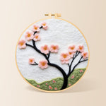 Minimalist pink flower branch needle felting kit for beginners with a round wooden frame