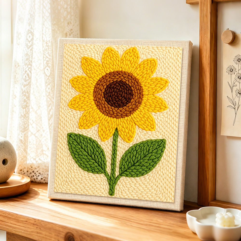 Minimalist sunflower punch needle artwork displayed on a table