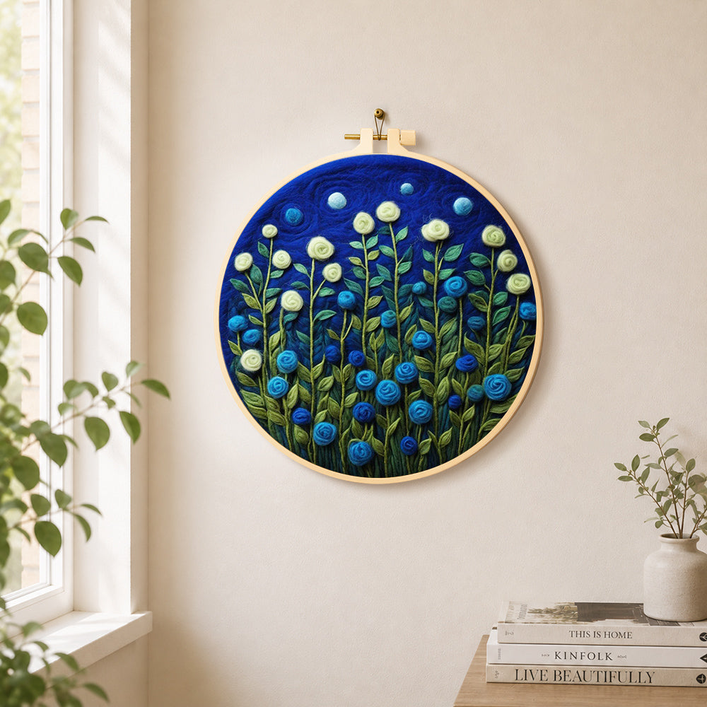 Mint green and blue roses at night needle felt wall art displayed in a bright home interior