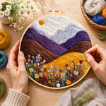 Creating the misty purple mountains and wildflowers wool painting by hand with a felting needle