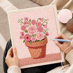 Creating handmade mixed pink blooms in pot punch needle artwork
