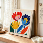 Modern abstract and colourful flowers punch needle artwork displayed on a table