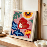 Modern abstract florals punch needle artwork displayed on a table
