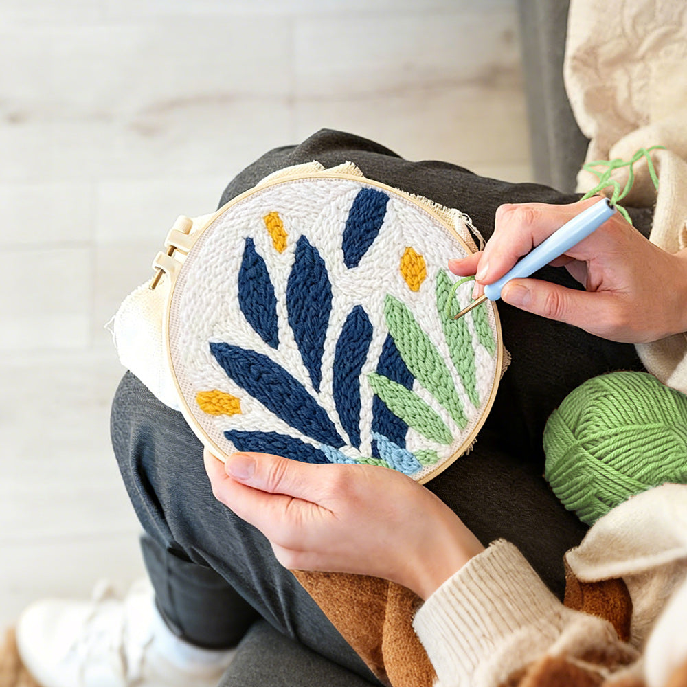 Creating handmade modern blue and green leaves punch needle artwork