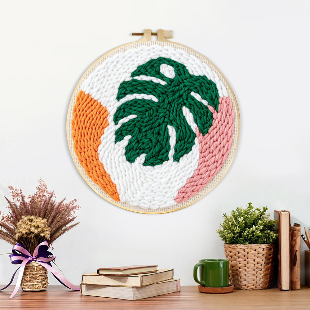 Finished modern monstera leaf artwork displayed on a wall
