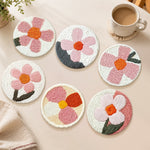 Modern pink floral punch needle coasters used for home decoration