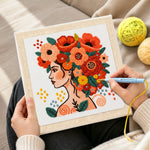 Creating handmade modern woman with vibrant floral crown punch needle artwork