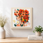 Finished modern woman with vibrant floral crown artwork displayed on a wall