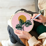 Creating handmade monstera leaf and golden sun punch needle artwork
