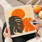 Creating handmade monstera leaf and sun punch needle artwork