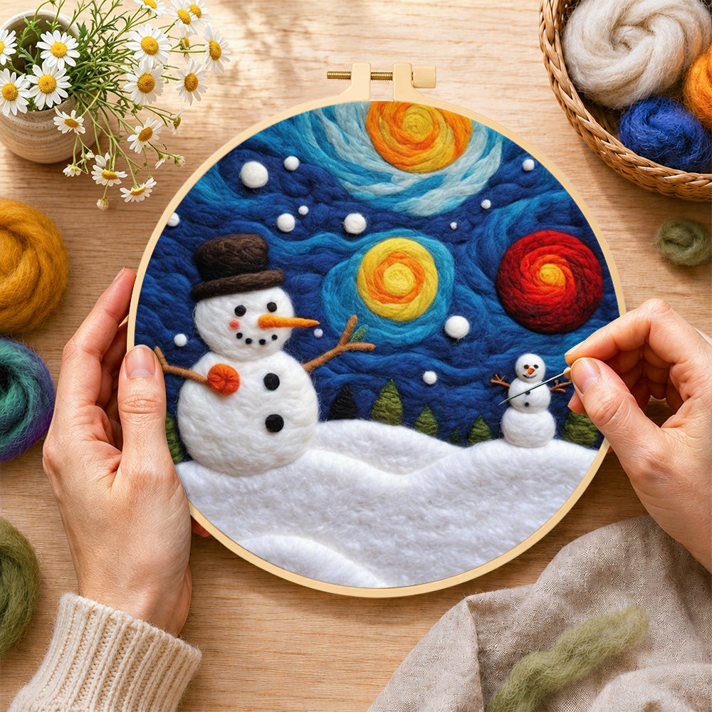 Creating the moon and snowman under the starry sky wool painting by hand with a felting needle