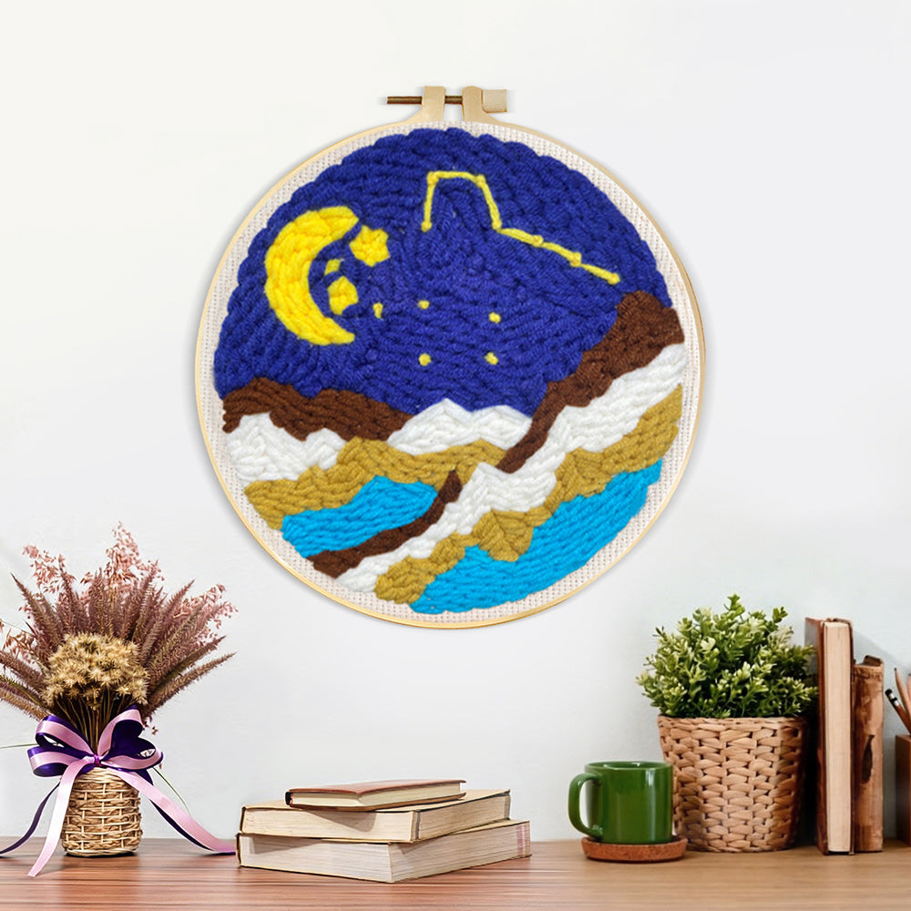 Finished moon and starry night over mountains artwork displayed on a wall