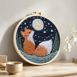Moonlit fox punch needle artwork displayed on a table