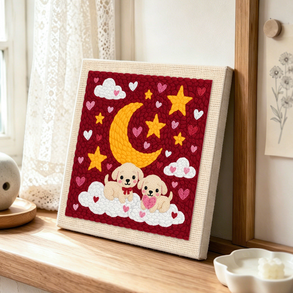 Moonlit puppies on clouds punch needle artwork displayed on a table