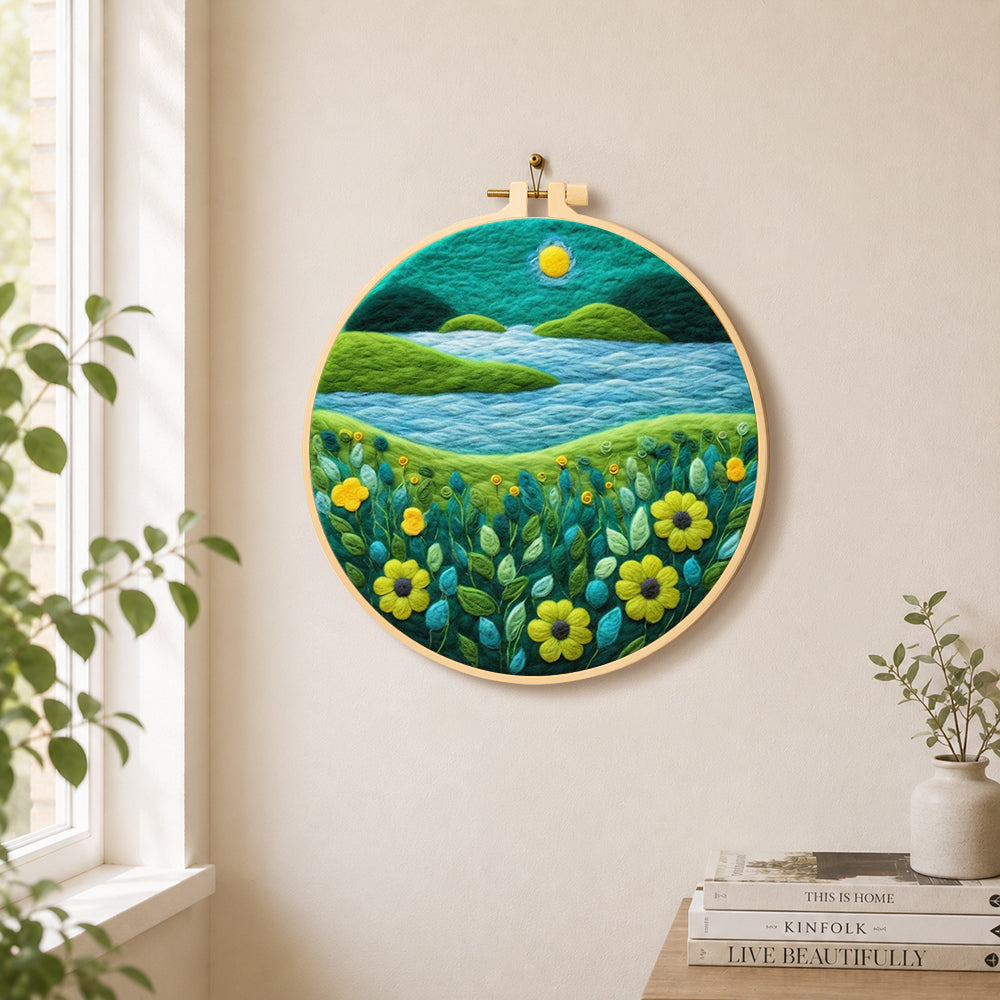 Moonlit river scene with bright flowers needle felt wall art displayed in a bright home interior