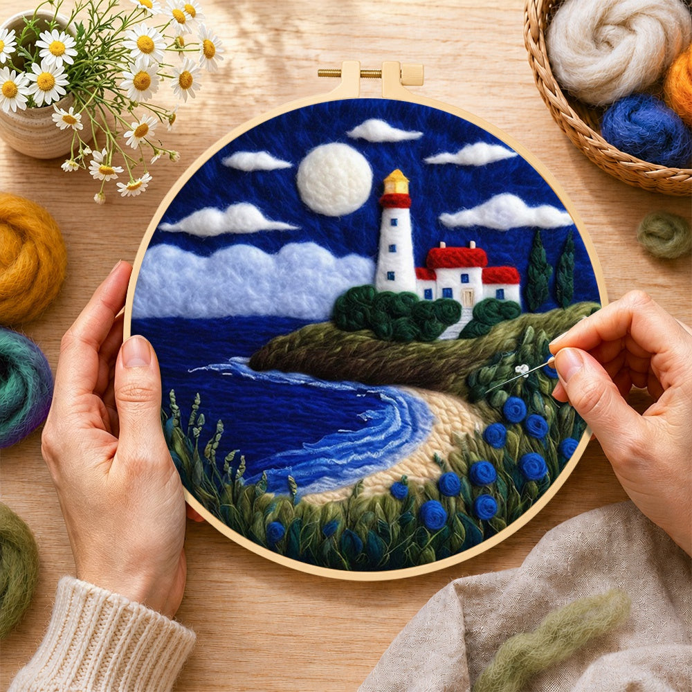 Creating the moonlit white lighthouse and blue roses wool painting by hand with a felting needle