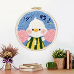 Finished motivated duck with fist pump artwork displayed on a wall