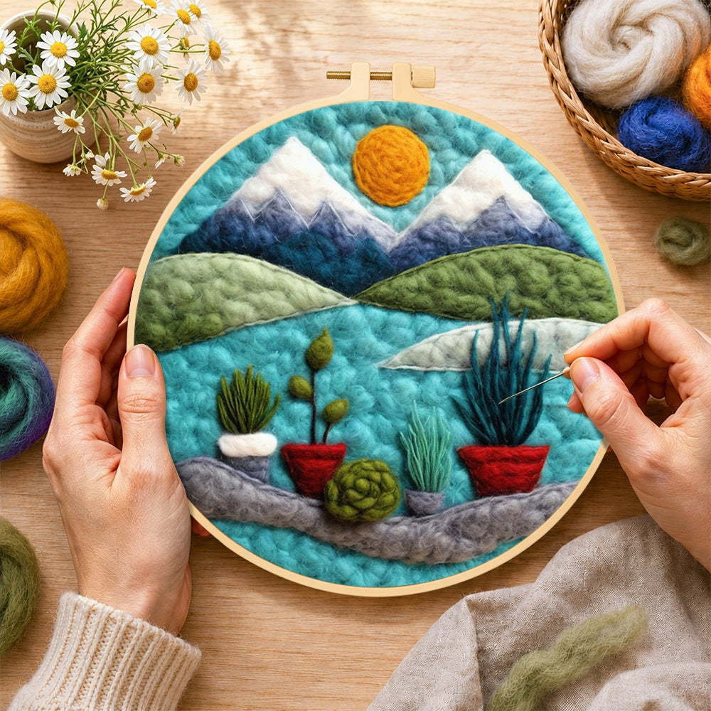 Creating the mountain and potted plants wool painting by hand with a felting needle