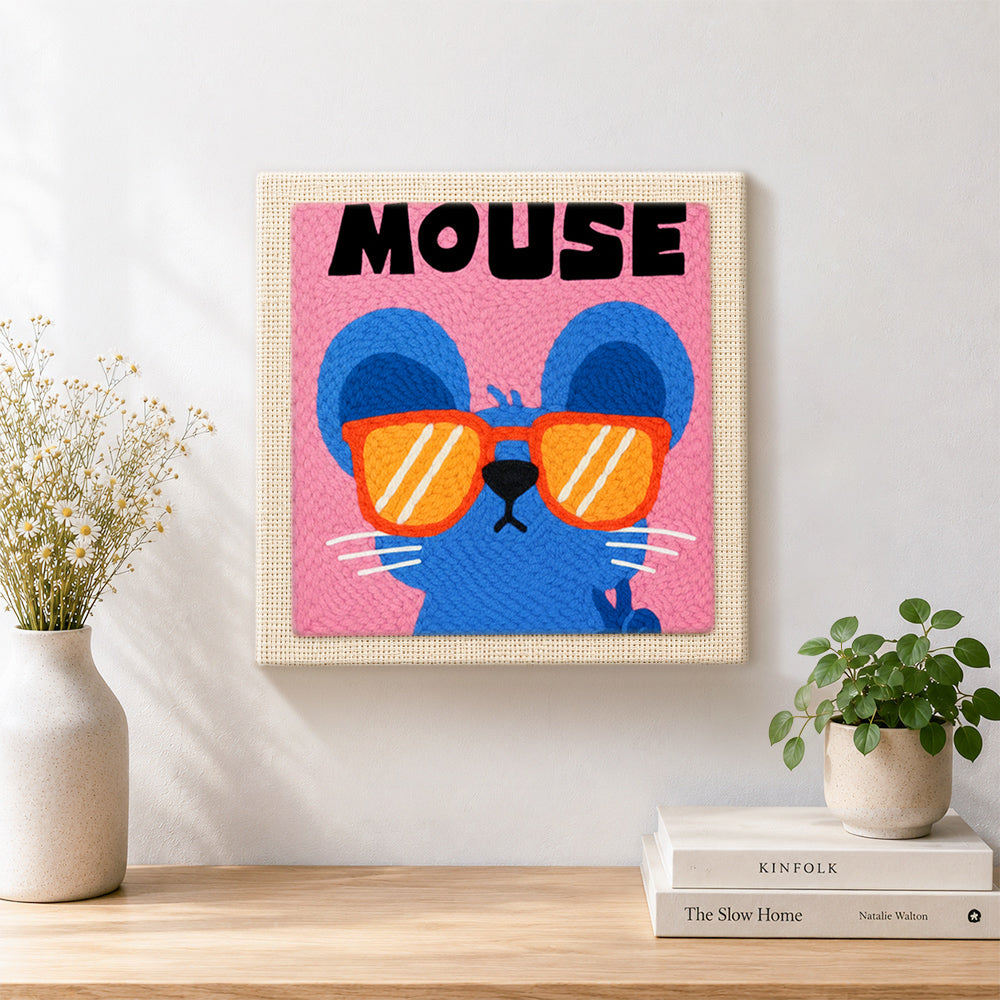 Finished mouse with sunglasses artwork displayed on a wall