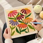 Creating handmade multicolour daisies punch needle artwork