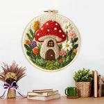 Finished mushroom house artwork displayed on a wall