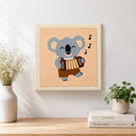 Finished musical koala playing accordion artwork displayed on a wall