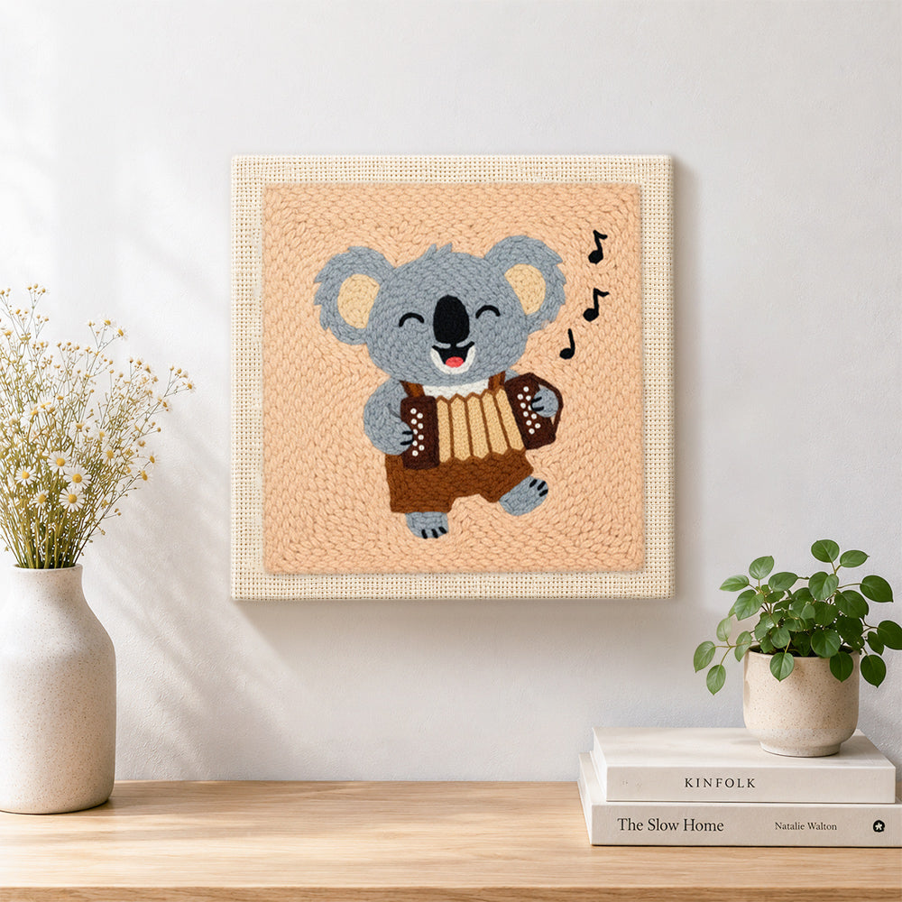 Finished musical koala playing accordion artwork displayed on a wall