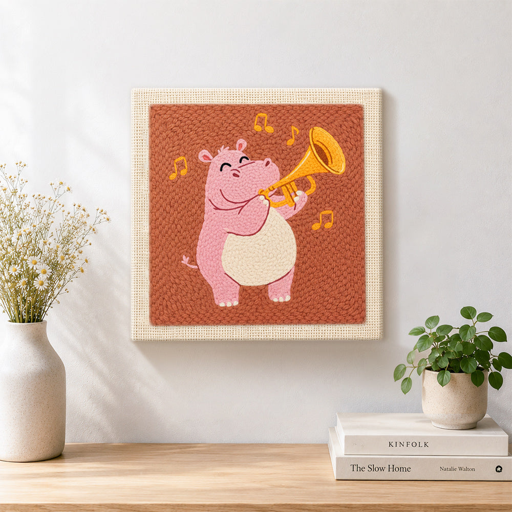 Finished musical pink hippo with trumpet artwork displayed on a wall