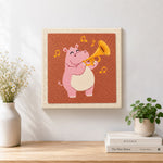 Finished musical pink hippo with trumpet artwork displayed on a wall