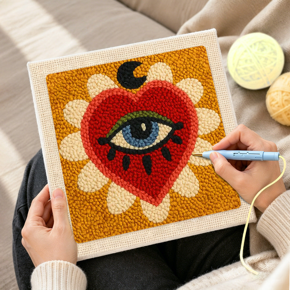 Creating handmade mystical evil eye heart punch needle artwork