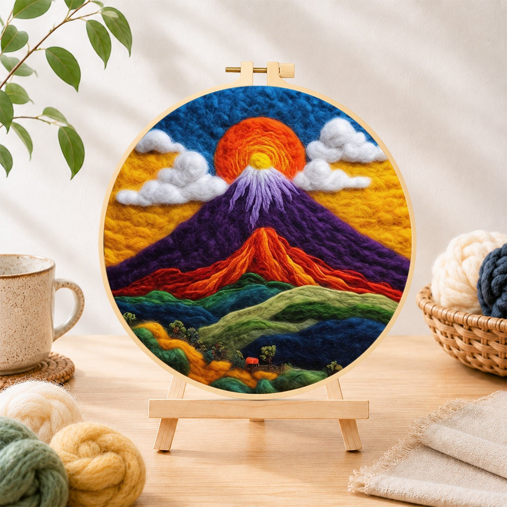 Finished mystical purple mountain needle felting displayed on a wooden easel