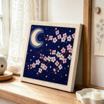 Night sky cherry blossom punch needle artwork displayed on a table