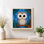Finished night sky forest owl artwork displayed on a wall